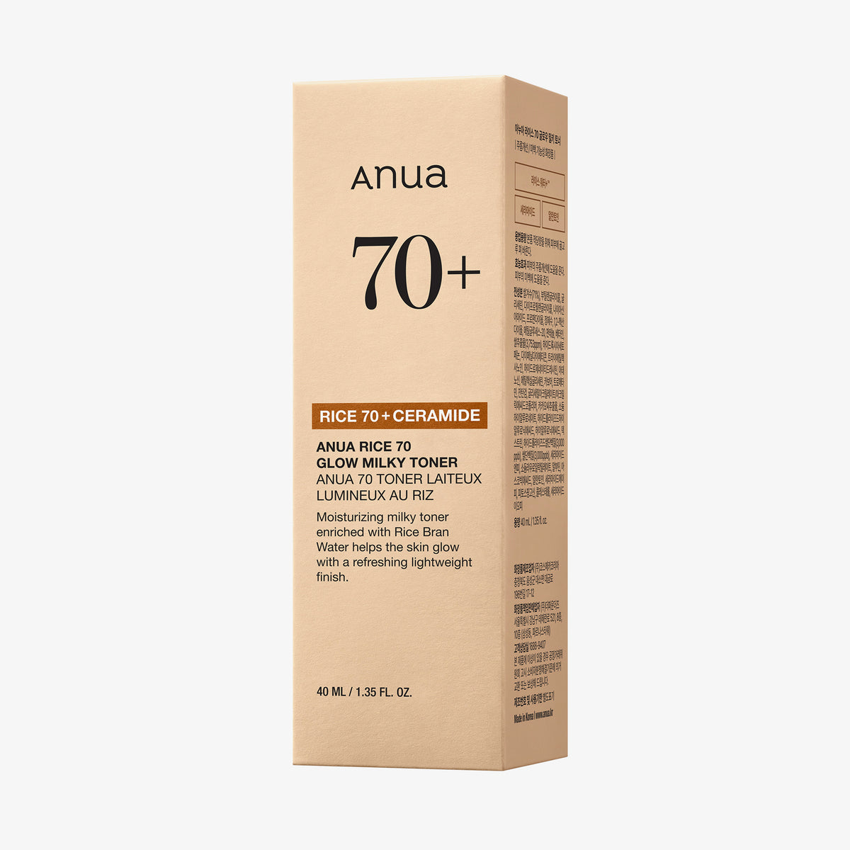 Eine beige Schachtel Anua Rice 70 Glow Milky Toner mit aufgedruckten Produktdetails auf der Vorder- und Seite.
