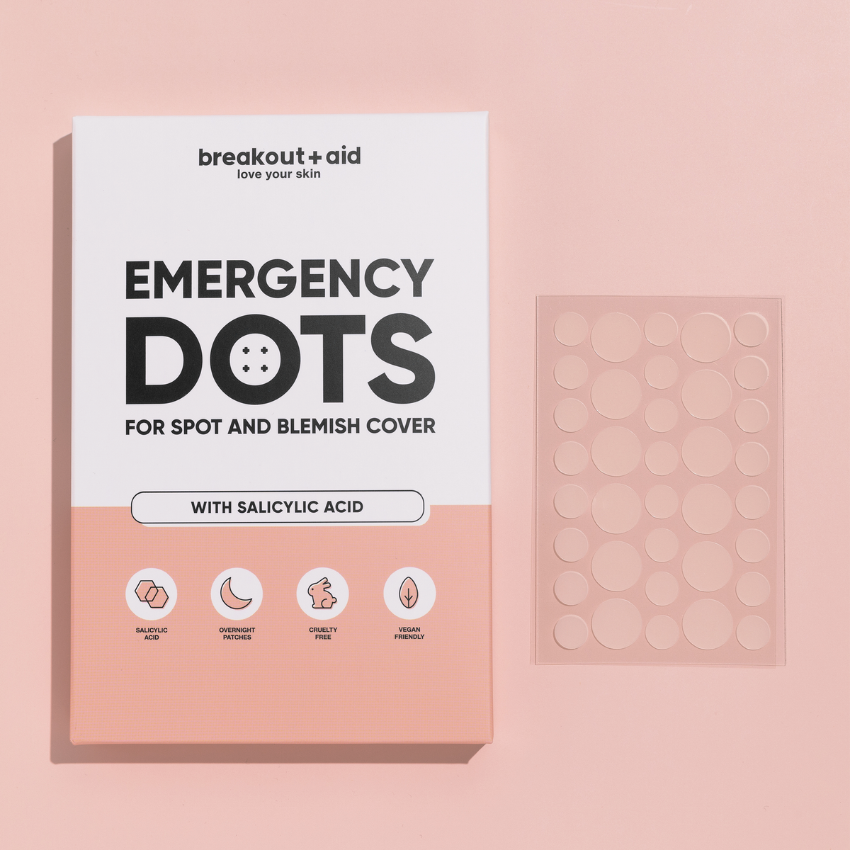 Packung Breakout+Aid Emergency Dots mit Salicylsäure und einem Bogen durchsichtiger Pickelpflaster.