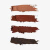 Vier Dewy Cheek & Lip Paletten von Danessa Myricks Beauty, cremig braune Swatches auf weißem Hintergrund gebürstet.