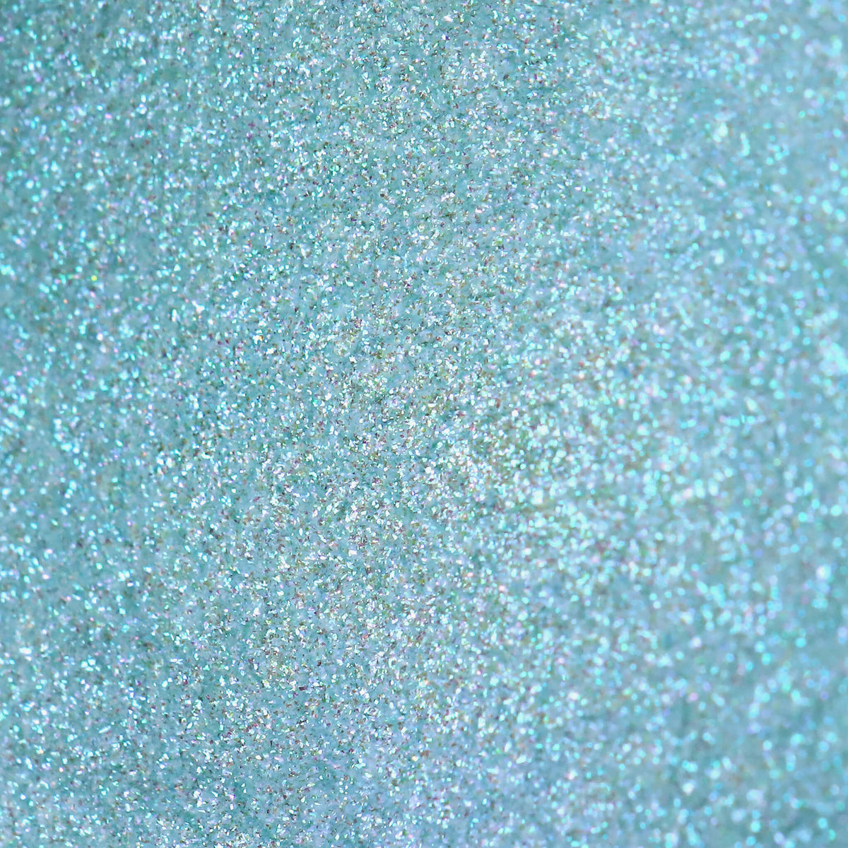 Nahaufnahme der Textur des Pastel Duochromes Loose Eyeshadow Tutu; ein eisblau schimmerndes Pigment.