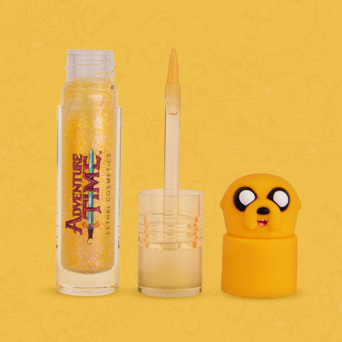 Geöffnete transparente Tube Adventure Time Lip Gloss mit orange glitzerndem Inhalt und Jake The Dog als Silikonkopf-Deckel.