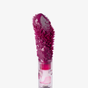 Eine Nahaufnahme von Lethal Cosmetics Infinity Lip Stains zeigt einen mauvefarbenden Applikator mit sichtbarem Glanz und Borsten vor einem weißen Hintergrund.