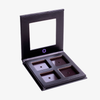 Lethal Cosmetics MAGNETIC™ Customizable Palette mit vier leeren Pfännchen und klarem Deckel, offen auf weißem Hintergrund dargestellt.