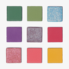 Die LH Cosmetics 1993 Palette enthält neun matte und glitzernde Lidschatten, die in einem 3x3-Raster auf einem weißen Hintergrund angeordnet sind.