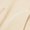 Nahaufnahme der Lumene NORDIC C [VALO] Tagescreme SPF 30 zeigt ihre glatte, cremig-beige Textur mit einer weichen, gewellten Oberfläche.