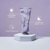 Eine violette Tube maria nila Booster Masque Sheer Silver wird auf einem Podest präsentiert, umgeben von hervorgehobenen Hauptmerkmalen.