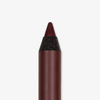 Eine Nahaufnahme des braunen Make-up-Stifts THE GLAM FEMULINE von Mesauda Beauty mit spitzer Spitze auf weißem Hintergrund.