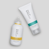 Philip Kingsley Moisture Balancing Conditioner vor einem hellgrauen Hintergrund.