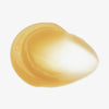 Ein Tropfen der goldenen, glänzenden Madagascar Centella Soothing Cream liegt durchscheinend auf einem weißen Hintergrund.