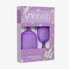 Das UNbrush Glitter Duo Set Amethyst Lavender von UNbrush wird in einer Geschenkbox mit silbernem Bandaufdruck geliefert.