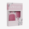 Das UNbrush Pastel Duo Set besteht aus zwei rosafarbenen Haarbürsten in einer Schachtel mit dekorativer Schleife.