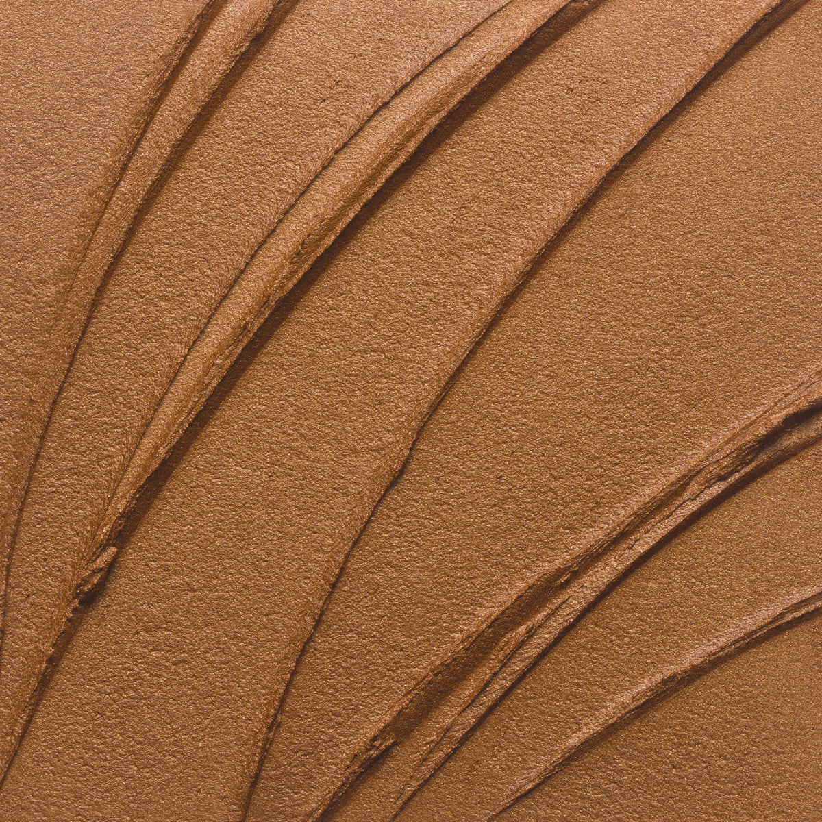 Nahaufnahme der Textur des Yummy Skin Blurring Balm Powder Lowlighter Incognito in Bronze.