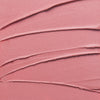 Nahaufnahme der Textur des Yummy Skin Blurring Balm Powder Lowlighter Unbothered in rosa.
