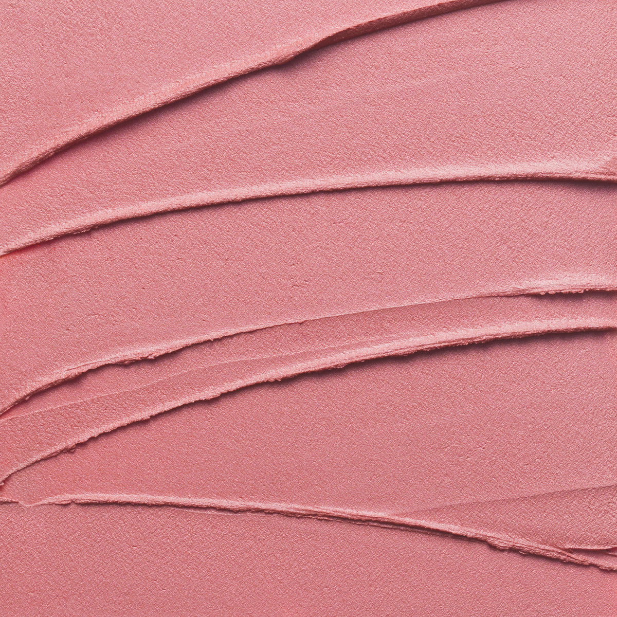 Nahaufnahme der Textur des Yummy Skin Blurring Balm Powder Lowlighter Unbothered in rosa.