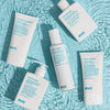 Mehrere Produkte von Evo auf blauer Wasseroberfläche, darunter der Head Mistress Cuticle Sealer.