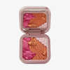 Lethal Cosmetics „The Legend of Korra“ – Pabu Blushlighter: Kompaktpuder mit rosa Fuchs, Wolken und Wellen in Rosa, Bronze und Gold.