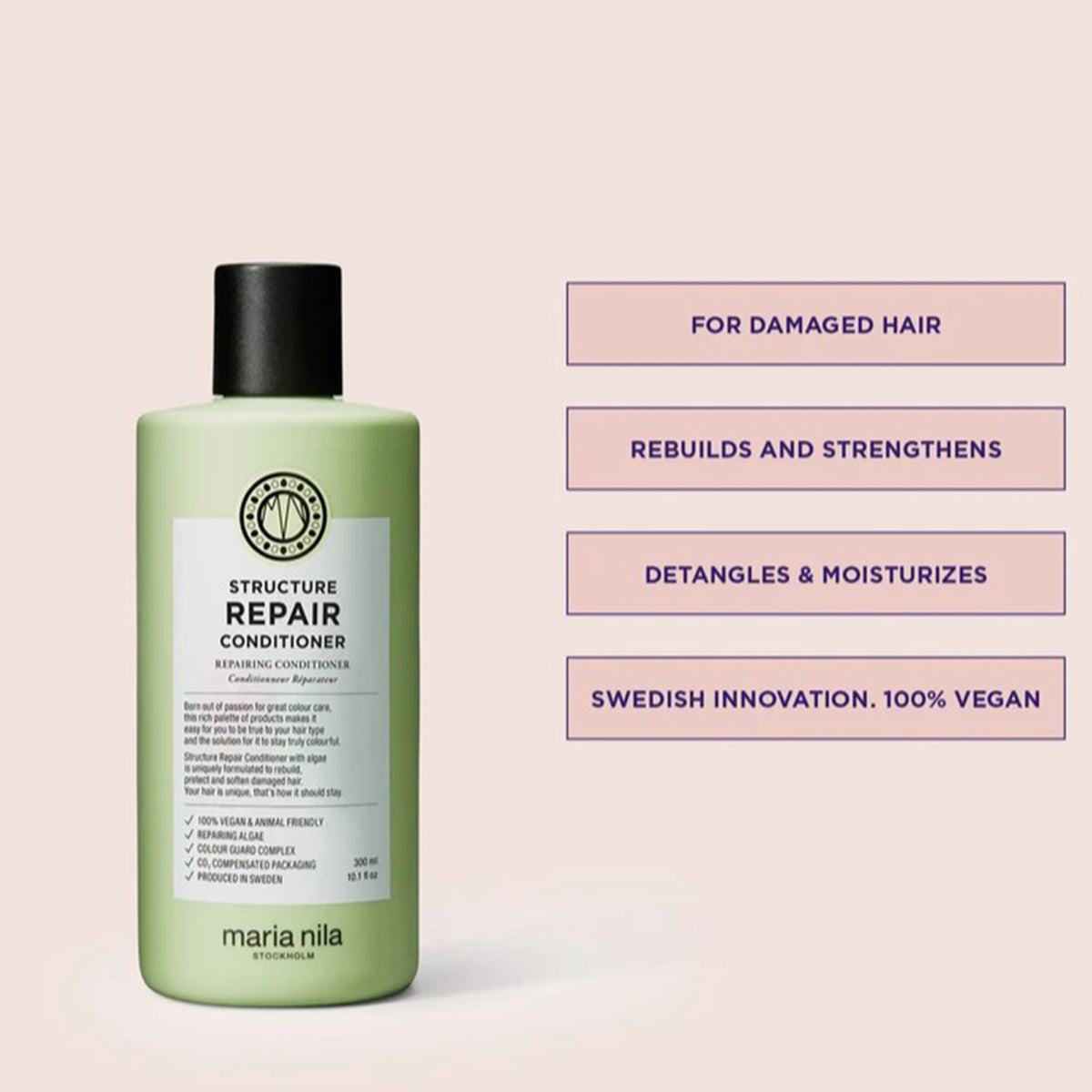 Grüne Flasche Structure Repair Conditioner mit schwarzem Deckel aus der Structure Repair Beauty Bag 2025, neben Produktvorteilen auf blassrosa Hintergrund.