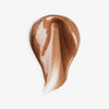 Ein bronze schimmernder Farbklecks des NABLA Cosmetics Angel Aura Bronze auf weißem Hintergrund.