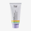 Eine Tube „Celebrate Tøday All-In Barrier Cream“ mit einem pastellfarbenen Regenbogenstreifen und lavendelfarbenen Deckel auf weißem Hintergrund.