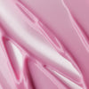 Das Viper Delicious Lip Kit enthält eine glatte, glänzende rosa Creme in gewirbelten, wellenförmigen Mustern, die das Licht wunderschön reflektieren.