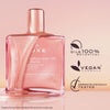 Rosa-glänzendes NUXE Huile Prodigieuse Or Florale läuft über eine eckige Glasflasche. Daneben Icons mit Texten.