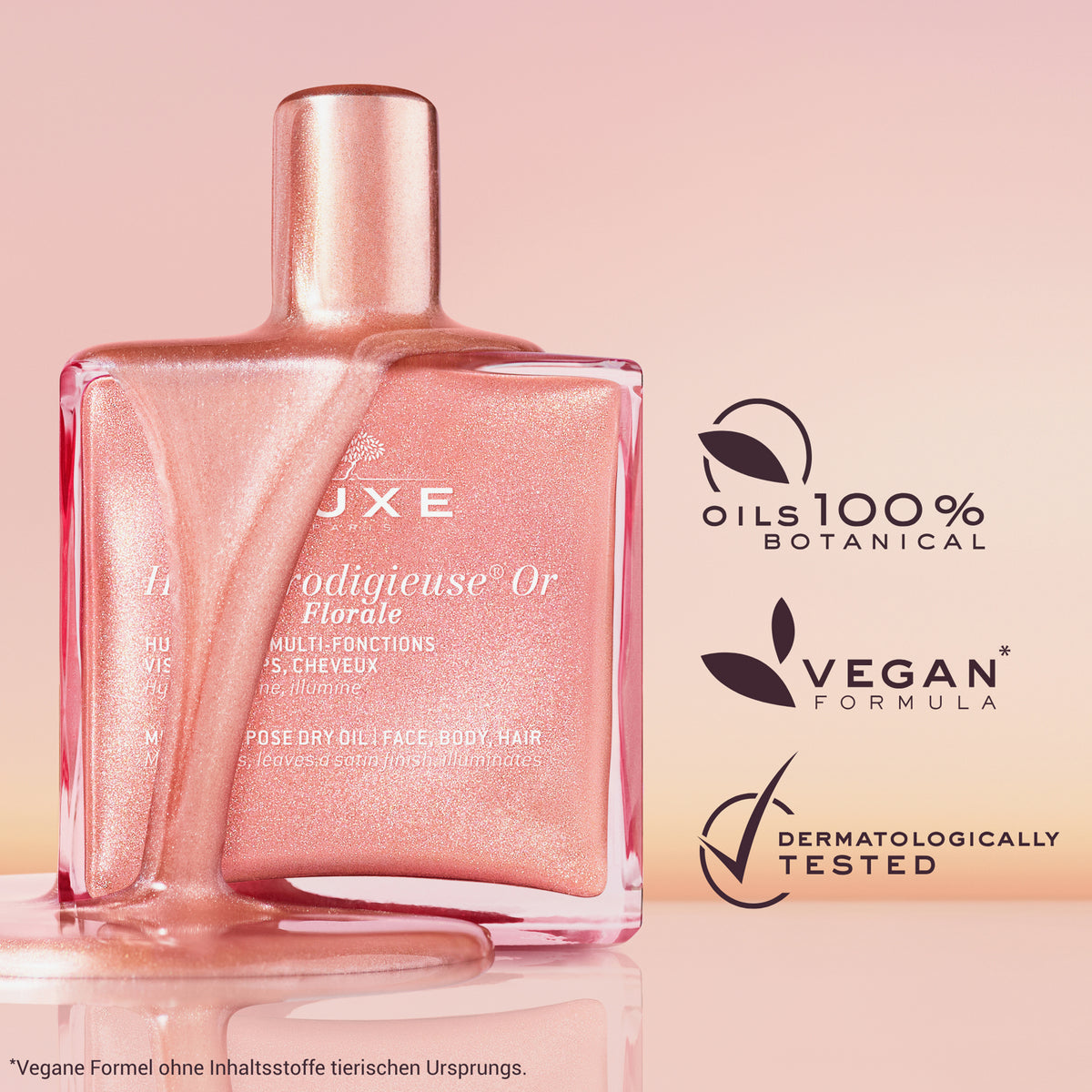 Rosa-glänzendes NUXE Huile Prodigieuse Or Florale läuft über eine eckige Glasflasche. Daneben Icons mit Texten.