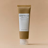 Eine Tube Madagascar Centella Ampoule Foam vor einem beigen Hintergrund.