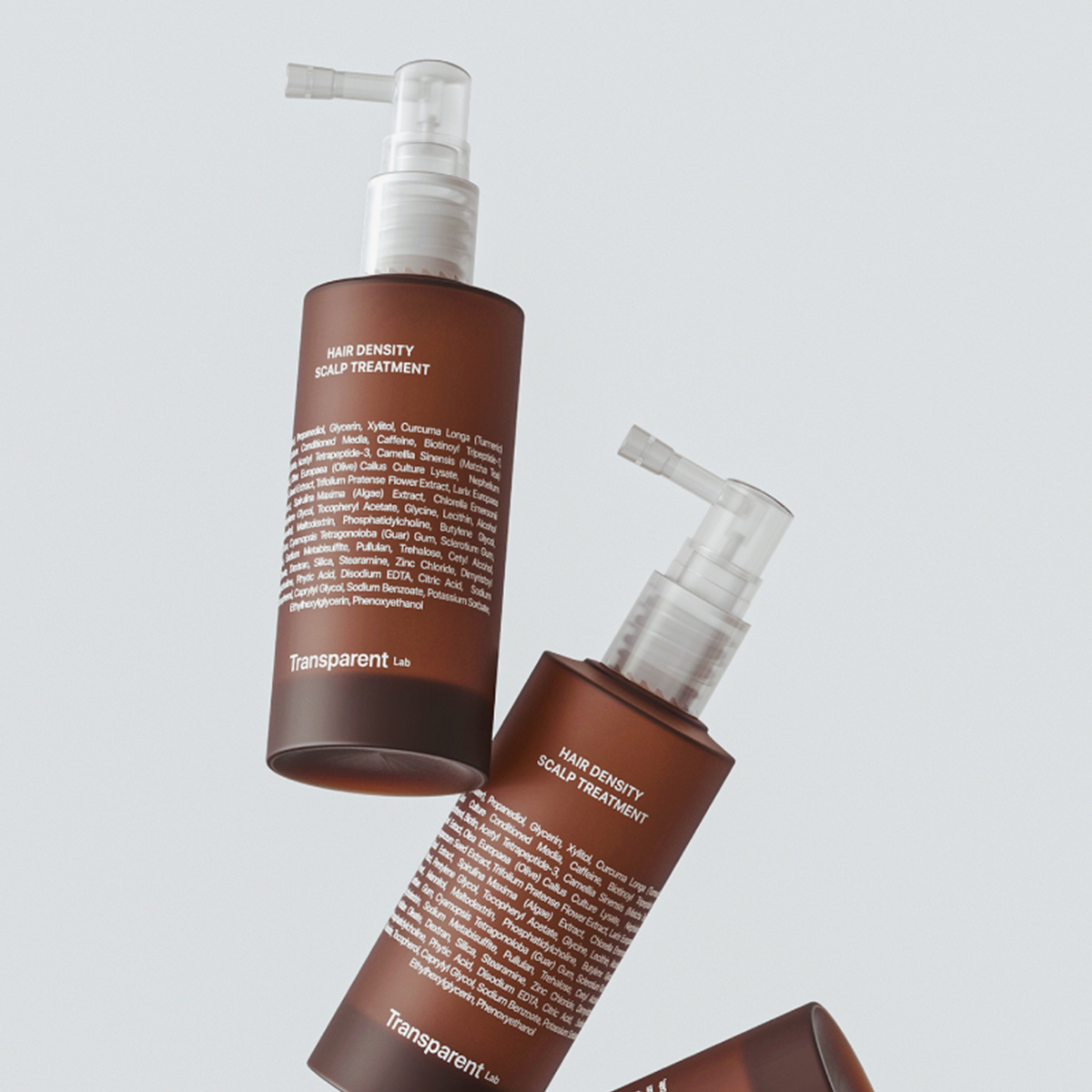 Zwei Flaschen Hair Density Scalp Treatment auf hellem Hintergrund, mit Pumpspendern.