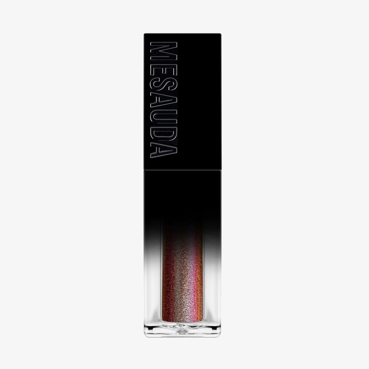 Der Galactic Shadow Flüssigliedschatten von Mesauda Beauty in einer rechteckigen Tube mit dem Mesauda-Label auf einer schwarzen Kappe.
