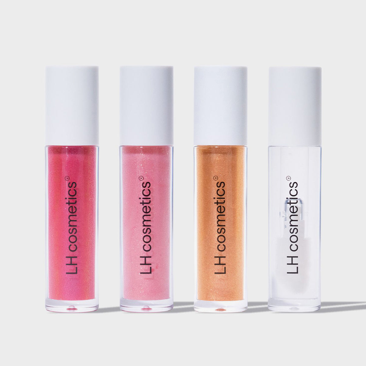 Vier Lipgloss-Tuben des LH Cosmetics Glazed in den Farbtönen Pink, Rosa, Orange und Klar vor weißem Hintergrund.