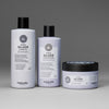 Maria nila Sheer Silver Shampoo, Conditioner und Haarmaske sind auf grauem Hintergrund abgebildet.