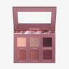 Die Mesauda Beauty Bare Harmony 2.0 Lidschattenpalette mit sechs Farbtönen, einem Spiegel im Deckel und beschrifteten Farbtonbezeichnungen.