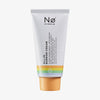 Weiße Tube „Celebration Tøday All-In Barrier Cream“ mit orangefarbener Kappe und bunten Streifen am Boden.