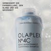 Blaue Flasche N°4C Bond Maintenance Clarifying Shampoo in weißem Schaum; daneben Infos zu verbesserter Farbbrillianz, Glanz und Weichheit.