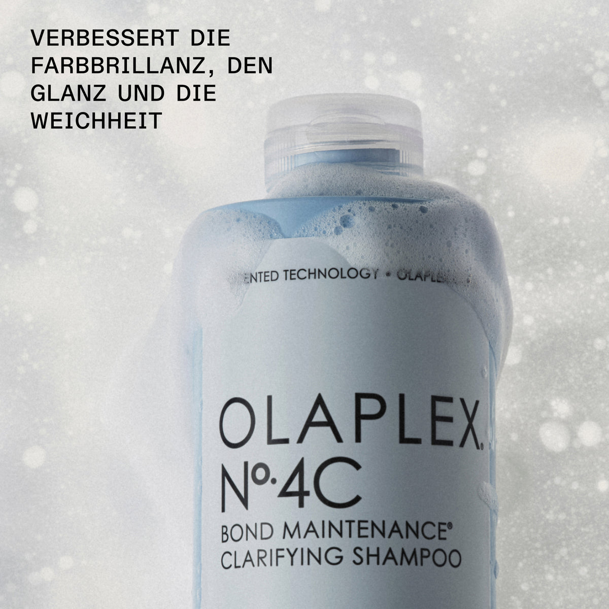 Blaue Flasche N°4C Bond Maintenance Clarifying Shampoo in weißem Schaum; daneben Infos zu verbesserter Farbbrillianz, Glanz und Weichheit.