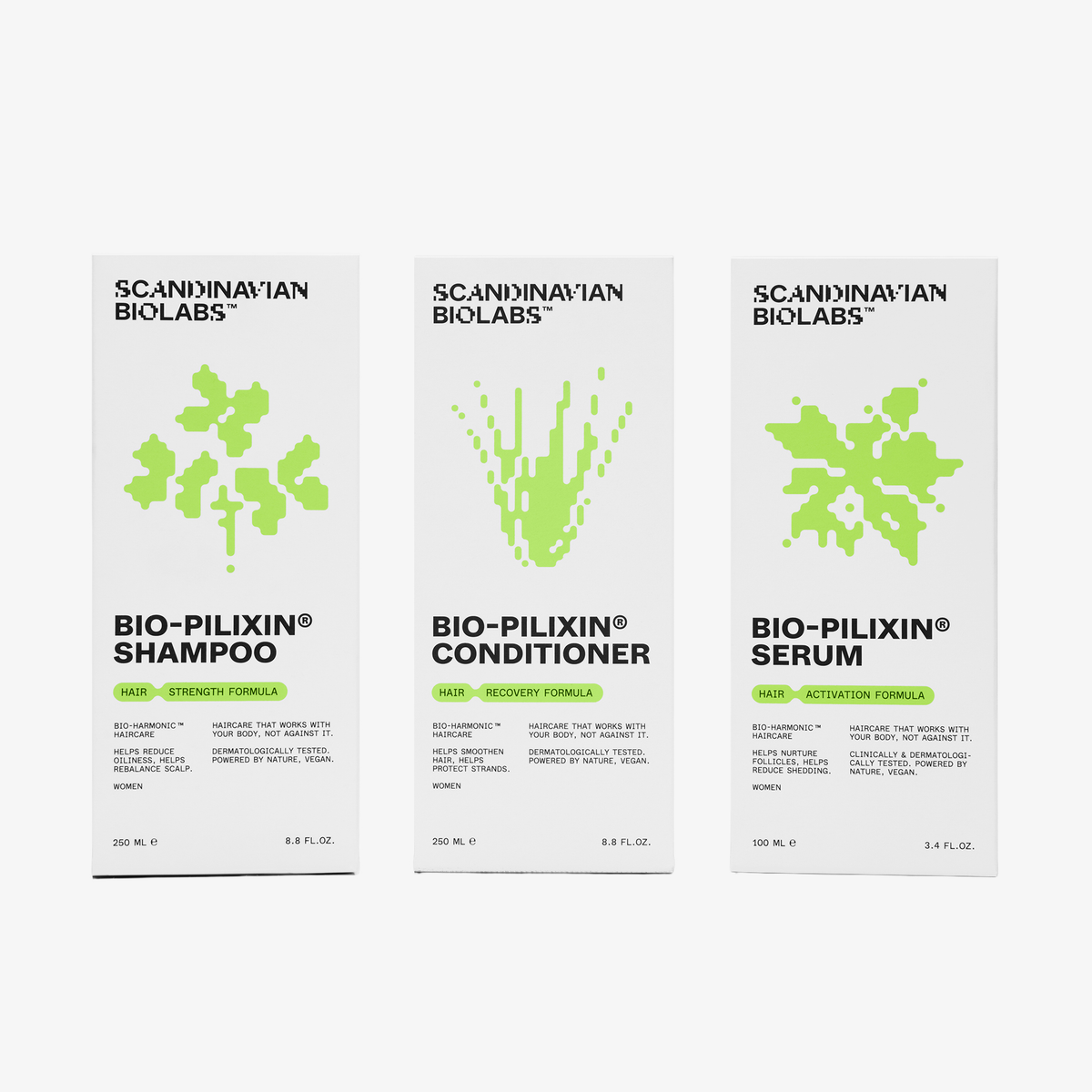 Drei Scandinavian Biolabs Verpackungen Women für Shampoo, Conditioner und Serum aus einer Haarpflege-Serie.