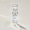 Skintegra Architect Serum in eleganter silber-weißer Pumpflasche mit Klarsichtdeckel, stehend auf hellem Untergrund mit Schattenwurf.