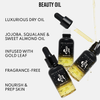 Danessa Myricks Beauty Oil Original in schwarzen Flaschen mit goldenen Flecken, Tropfer und den wichtigsten Vorteilen auf weißem Hintergrund.