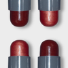 Vier LH Cosmetics Artistick Blush rote Metallic-Lippenstifte mit grauen Etuis, dargestellt in einem 2x2-Raster auf weißem Hintergrund.
