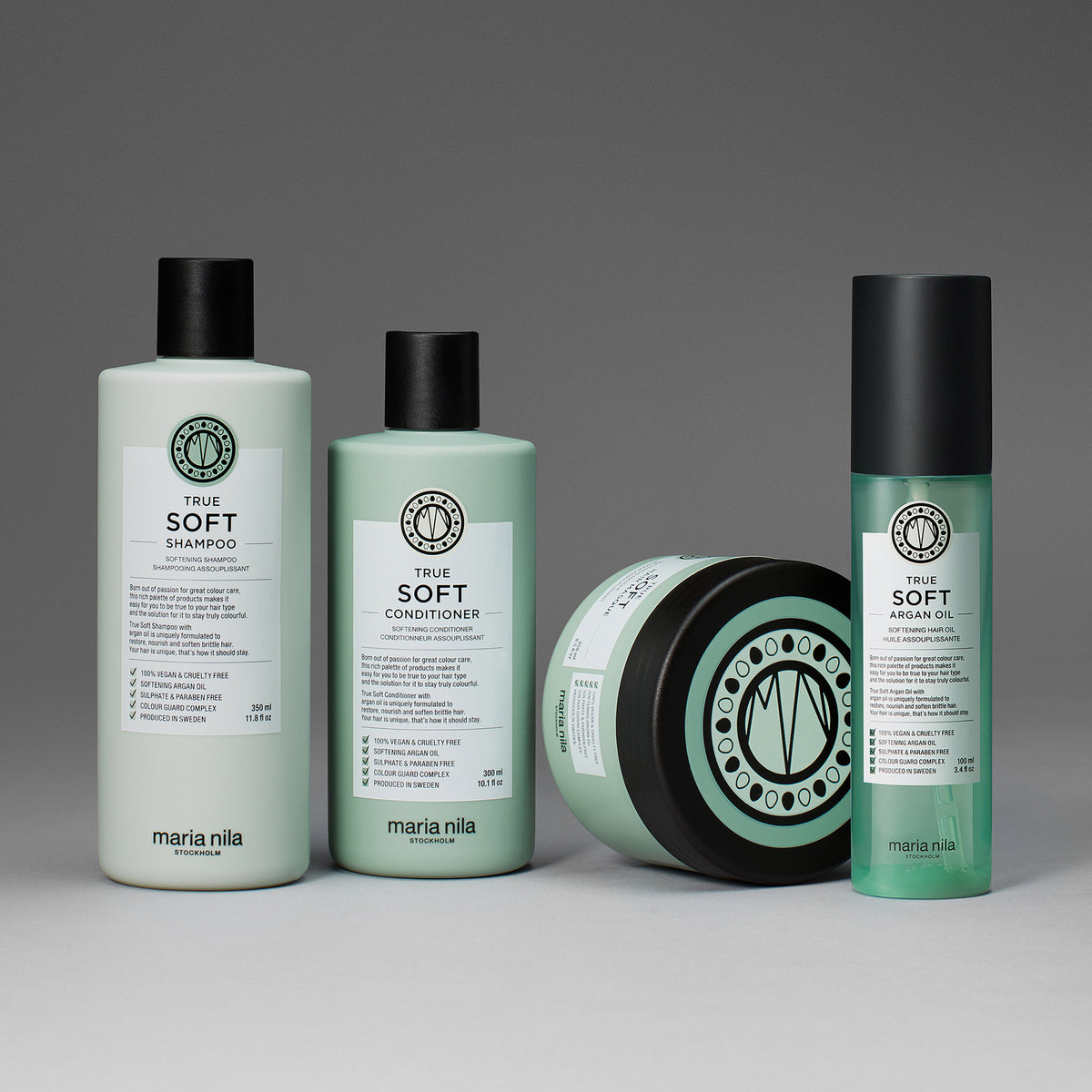 Vier Maria Nila True Soft Produkte vor dunkelgrauem Hintergrund.