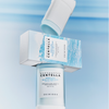 Der Madagascar Centella Hyalu-Cica Silky-Fit Sun Stick mit seiner blau-weißen Box wird auf hellem Hintergrund präsentiert.
