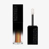 Der Galactic Shadow Flüssigliedschatten von Mesauda Beauty in einer rechteckigen Tube mit dem Deckel und Applikator daneben.
