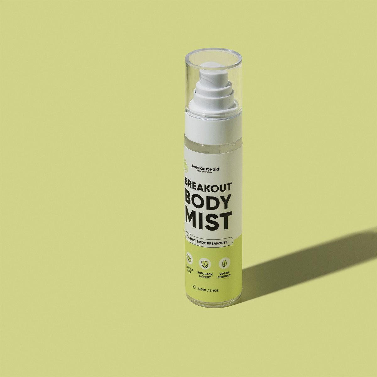 Eine durchsichtige Breakout+Aid Breakout Body Mist-Sprühflasche mit klarem Verschluss, die speziell zur Behandlung von Hautunreinheiten am Körper bestimmt ist.