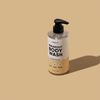 Pumpflasche mit dem klaren Breakout+Aid Breakout Body Wash mit gelbem Etikett.
