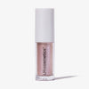 Transparente Tube Sparkl von LH Cosmetics mit weißer Kappe und hellrosa schimmerndem Farbton namens Delish.