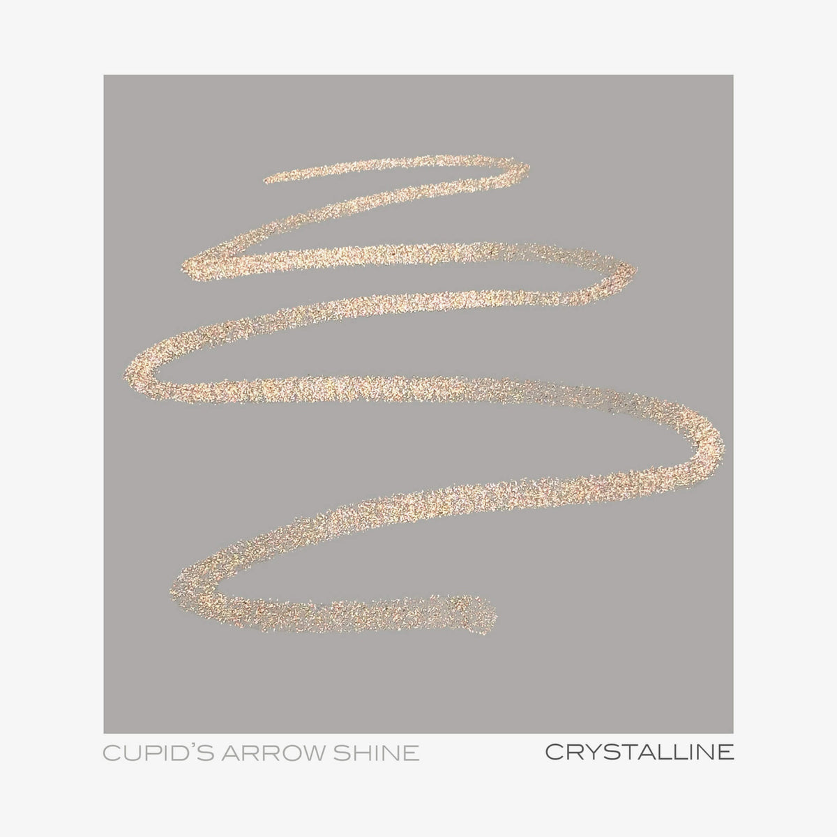 Ein goldglitzernder Zickzack auf Grau mit dem Text „Cupid’s Arrow Longwear Stylo Arrow Shine“ und „Crystalline“.