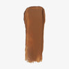 Ein Farbmuster des Chroma Conceal Liquid Concealer N5 mit glatter, cremiger Textur auf weißem Hintergrund.