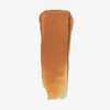 Ein Farbmuster des Chroma Conceal Liquid Concealer W7 mit glatter, cremiger Textur auf weißem Hintergrund.