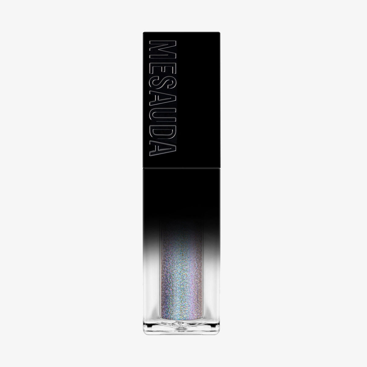 Der Galactic Shadow Flüssigliedschatten von Mesauda Beauty in einer rechteckigen Tube mit dem Mesauda-Label auf einer schwarzen Kappe.
