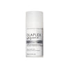 Weiße Flasche von OLAPLEX No°5 Moisturize & Mend Leave-in Conditioner mit schwarzem und grauem Text auf einfarbigem Hintergrund.